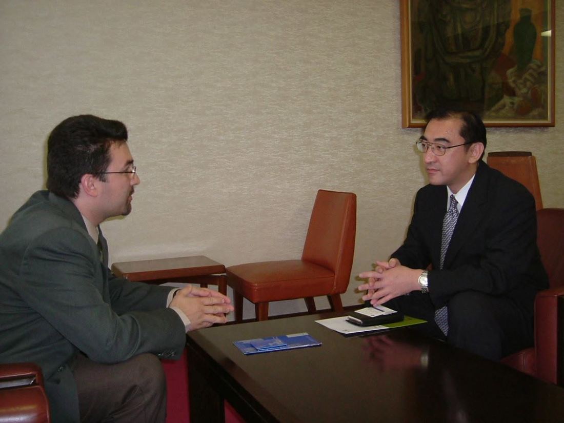 Antonel Neculai in conversation with a Japanese professor during his business studies in Japan