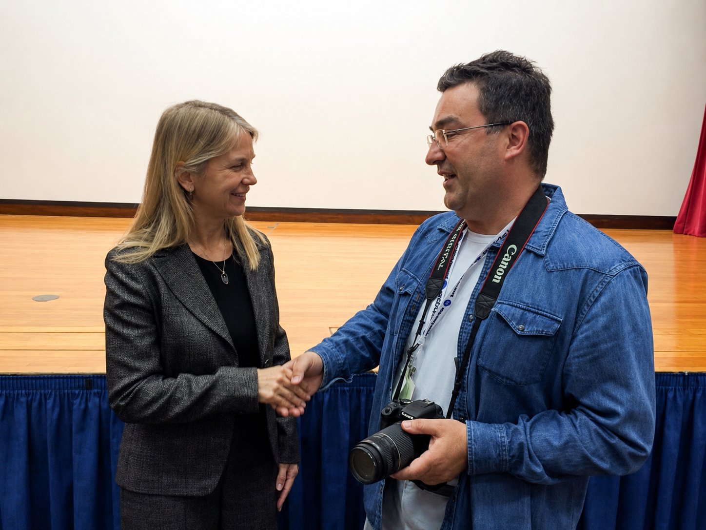 Antonel Neculai shaking hands with Dava Newman, then NASA Deputy Administrator, at Kennedy Space Center
